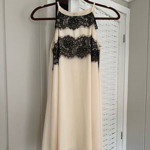 cream with black lace dress